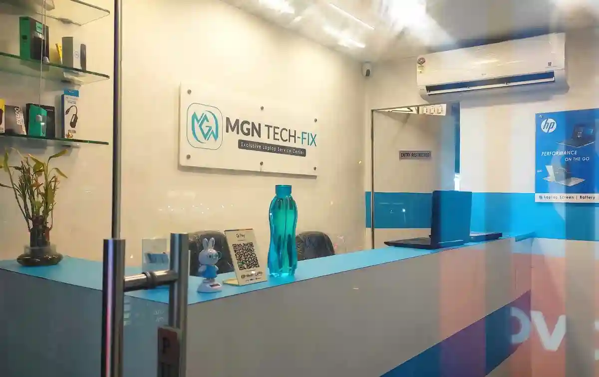 Experienced technician repairing a laptop motherboard at MGN Tech-Fix